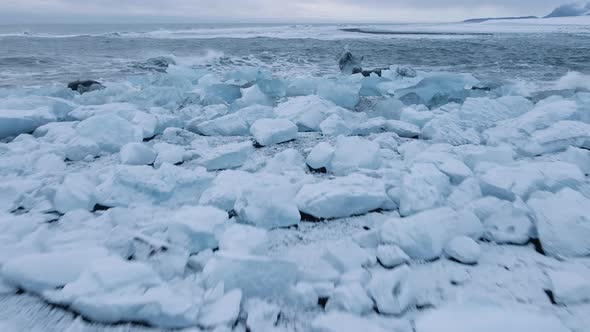 Drone Over Photographer on Diamond Beach Near Glacier Lagoon of Iceland