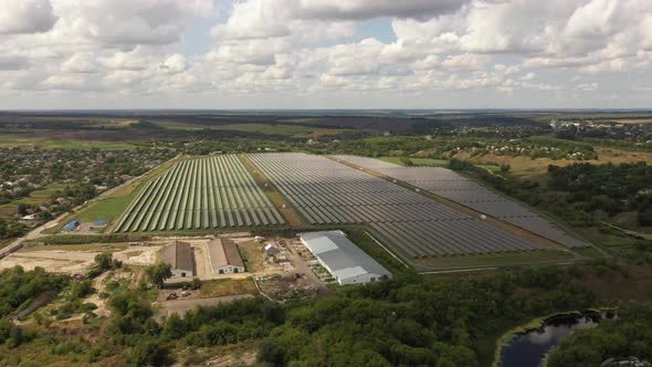 Aerial view of the Solar panels on a hill above the river