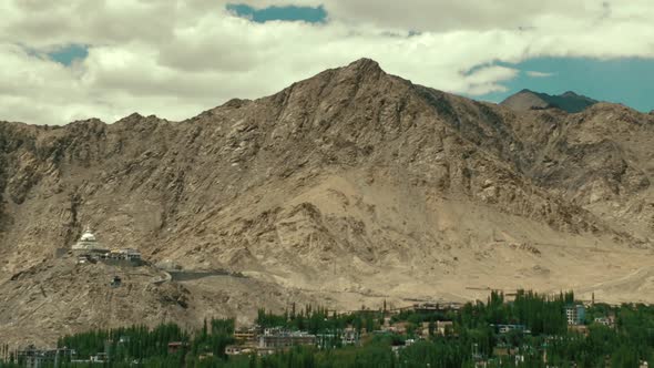 the leh city with house made of mud and local materials crowded the Buddhist flag fluttering due to