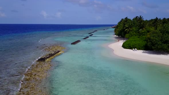 Drone view sky of tourist beach voyage by blue water with sand background