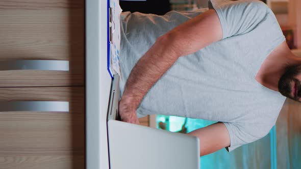 Vertical Video Tired Manager Looking Astonished at Watch