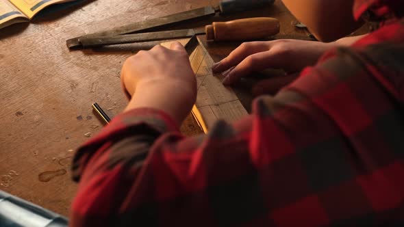 Lefthanded Boy Working with a Clerical Knife