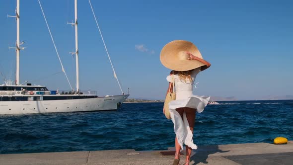 Beautiful Girl Tourist Walking on Spetses Embankment Greece