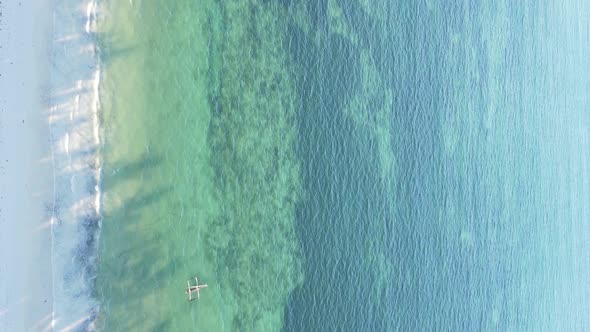 Vertical Video of the Ocean Near the Coast of Zanzibar Tanzania Aerial View