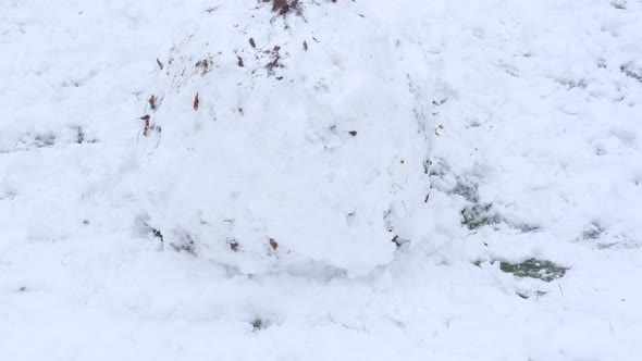 Child Make a Snow Ball
