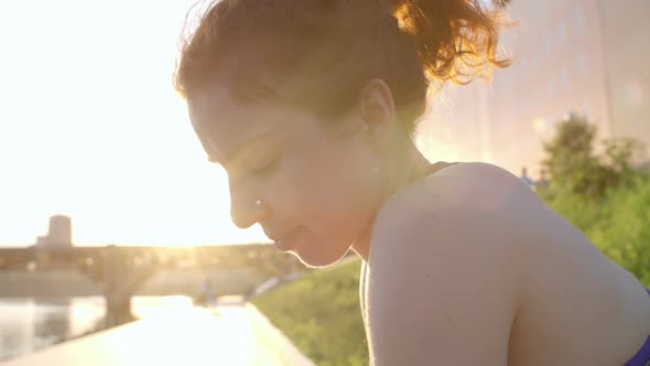 Beautiful Woman Sitting on Embankment