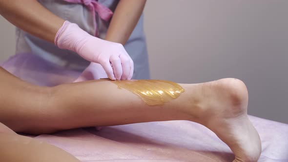 Cropped View of Waxing Hair Removal Procedure in Salon