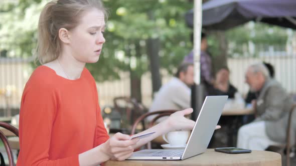 Online Shopping Failure for Young Woman Sitting on Bench