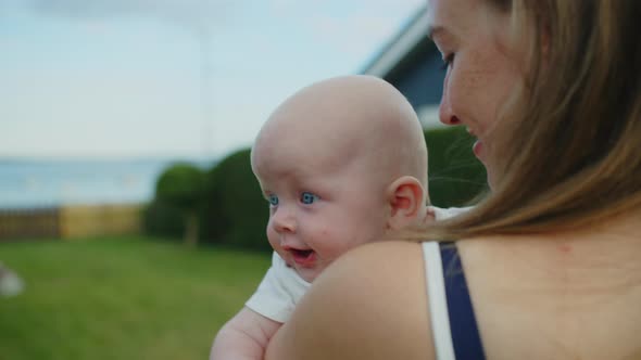 Baby Girl Resting In Her Mother's Arms