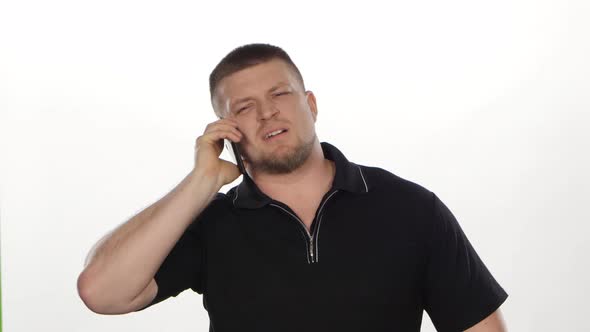 Happy Man Talking on Smartphone. White