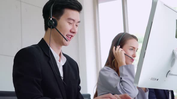 Business People Wearing Headset Working in Office