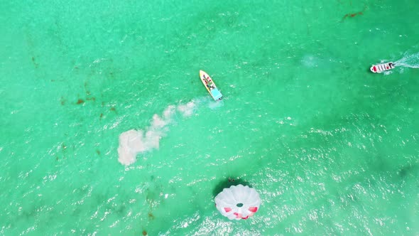 People Having Fun Doing Parasailing