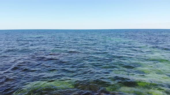 Aerial Low Flight Over the Surface of the Ocean