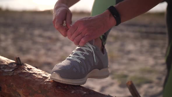 Fit Female Hands Tying Shoelace on Sneaker Outdoor