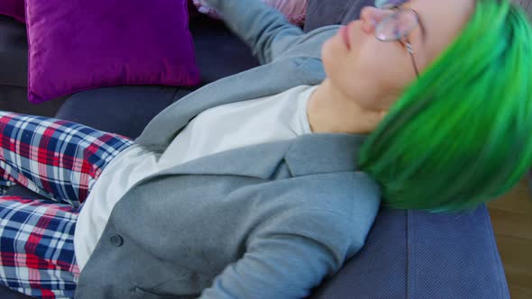 Young Lady Resting on Sofa at Home After Hard Day