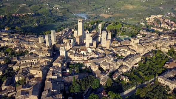 The Tuscan town of San Gimignano Italy with Torre Grossa and San Gimignan basillica buildings, Aeria
