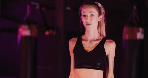 Young Sporty Woman Exercising At Health Club