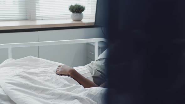 Black Boy Sleeping in Hospital Bed