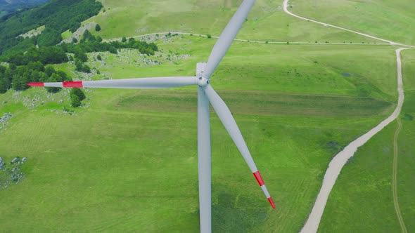 Aerial View of White Wind Turbines Generator in a Field in Montenegro