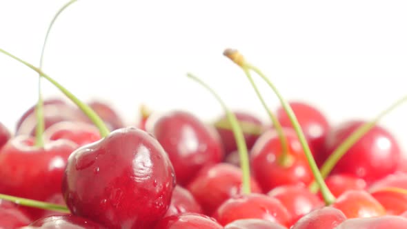 Fresh organic cherries on top of many slow tilting 4K 3840X2160 30fps  UltraHD footage - Tilt on red