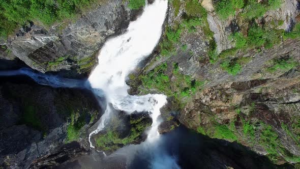 Breathtaking top-down aerial view of Voringfossen waterfall in Norway.