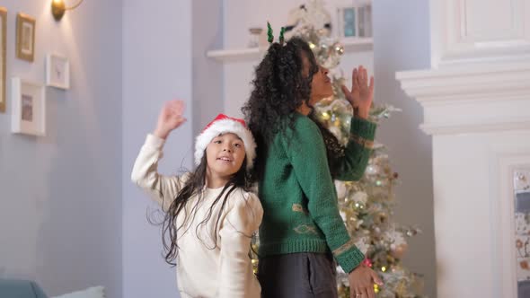 Brunette Girl and Black Woman Dance in Festive Atmosphere