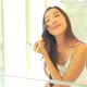 Young asian woman check her face on mirror - VideoHive Item for Sale