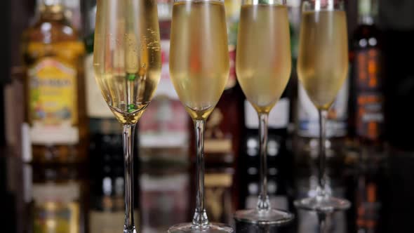 Closeup of a Row of Champagne Glasses in a Bar