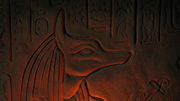 Zoom Out As Egypt Carving Is Lit Up Showing Jackal Creature