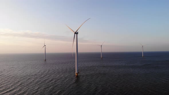 Offshore Windmill Park with Clouds and a Blue Sky Windmill Park in the Ocean Drone Aerial View with