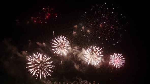 Big real fireworks display celebration and colorful New year's eve. An abstract blur of real golden