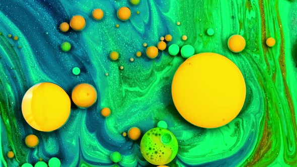 Yellow Inks React To Form a Beautiful Structure of Paint Bubbles. Colorful Liquid Ink. Multicolored