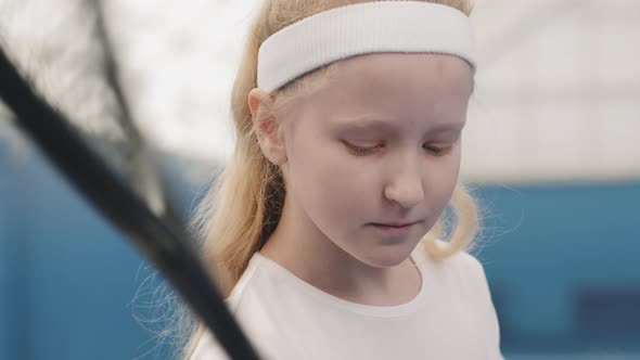 Portrait Of Little Female Tennis Player