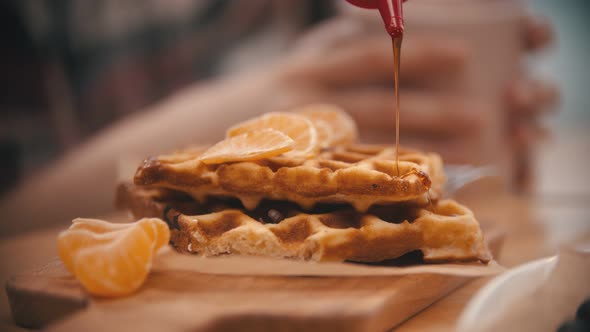 Covering a Waffle with a Syrup