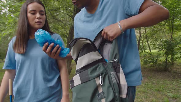 Mixed Race Volunteers Getting Ready Picking Up Plastics Outdoors