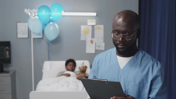 Male Nurse Posing in Hospital Ward