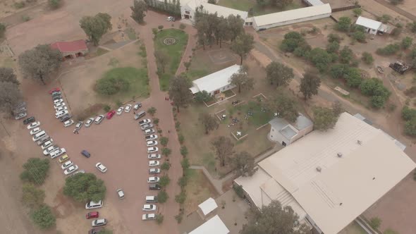 Aerial shot of red carpet event showing cars arriving