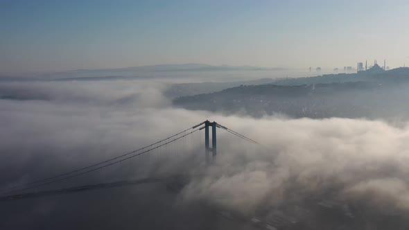 aerial video of bosphorus Bridge on a foggy day in Istanbul, Turkey. July 15 Martyrs Bridge 11