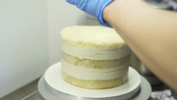 Confectioner Takes the Baking Tin Off the Biscuit Cake