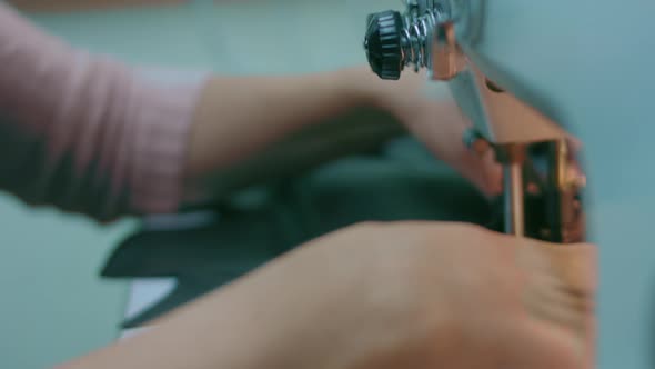 Sewing Machine in a Leather Workshop in Action with Hands Working on a Leather Details for Shoes