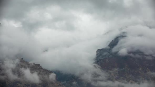 Clouds rolling over canyon in the Wasatch Mountains