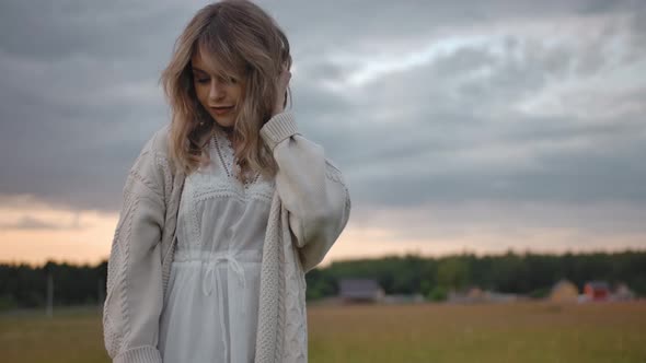 Charming Tender Woman in Farm Field During Sundown