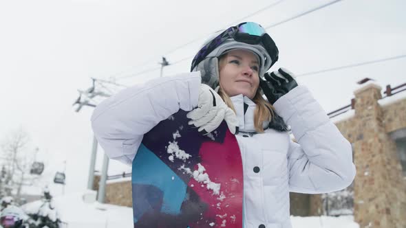 Close Up Portrait of Young Athletic Smiling Woman After Riding on Snowboard 6K