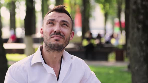 A Handsome Man in a White Shirt Makes Online Profit Counts Dollars Rejoices