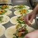 Closeup of Hands Preparing Vegetarian Wraps in a Restaurant Kitchen - VideoHive Item for Sale
