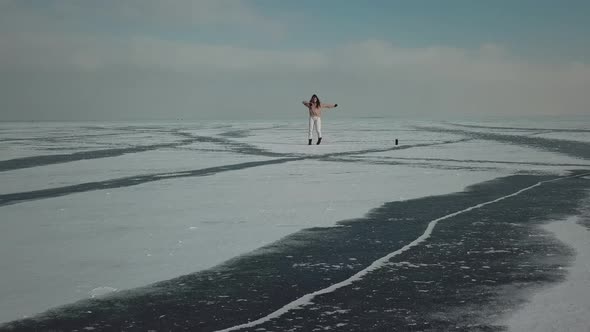 Stylish Young Woman Professional Dancer Dancing Energetic Jazz Funk or Hip Hop on Arctic Frozen Lake