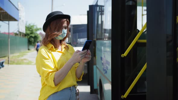 Precautions, Young Beautiful Girl in Medical Mask To Protect Against Virus or Infection Uses Her