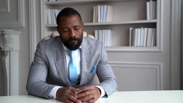 Frustrated and Sorrowful Businessman Is Sitting Alone in His Working Office in Home, Portrait of