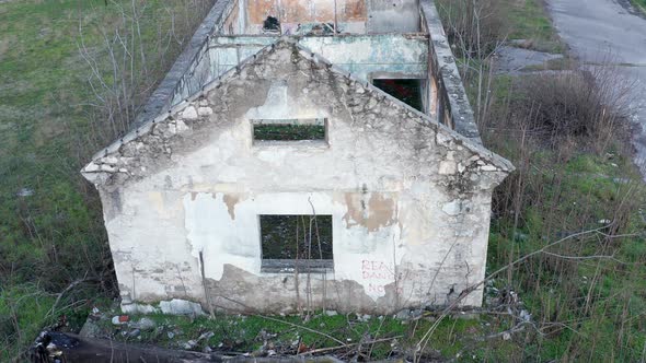 Roofless derelict building abandoned after hurricane: walls of demolished and dilapidated house