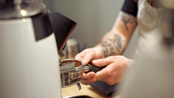 Barista Making Coffee in Coffeeshop